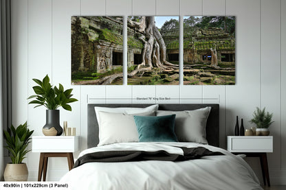 a bed room with a neatly made bed and three pictures on the wall