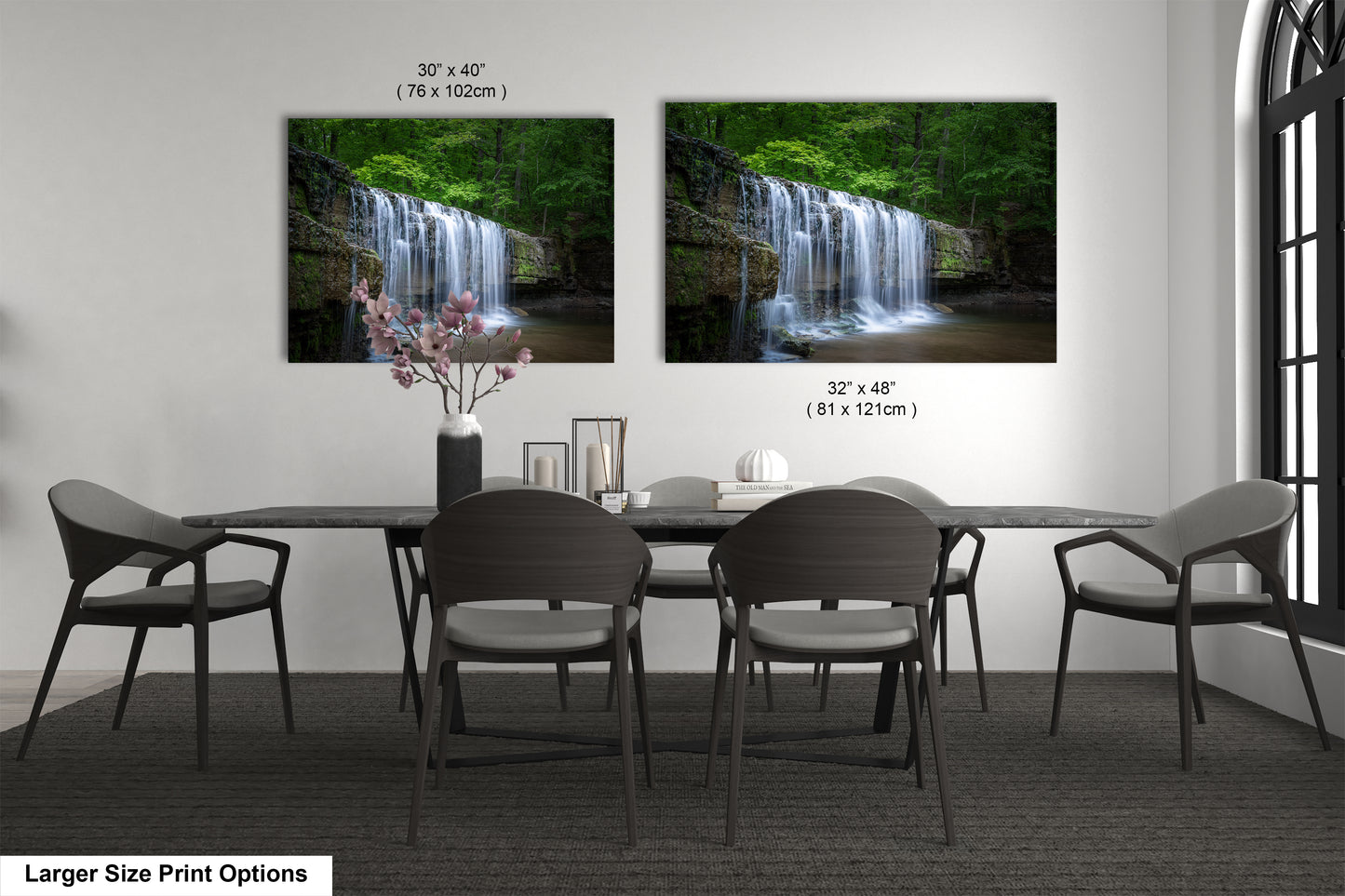a dining room table with four chairs and a waterfall in the background