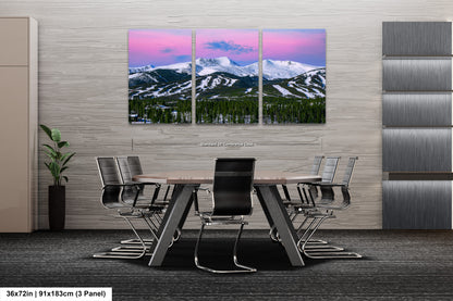 a dining room with a table and chairs with mountains in the background