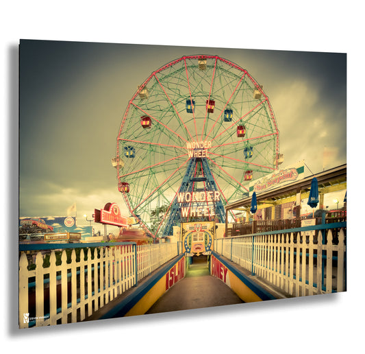 a large ferris wheel sitting next to a white fence