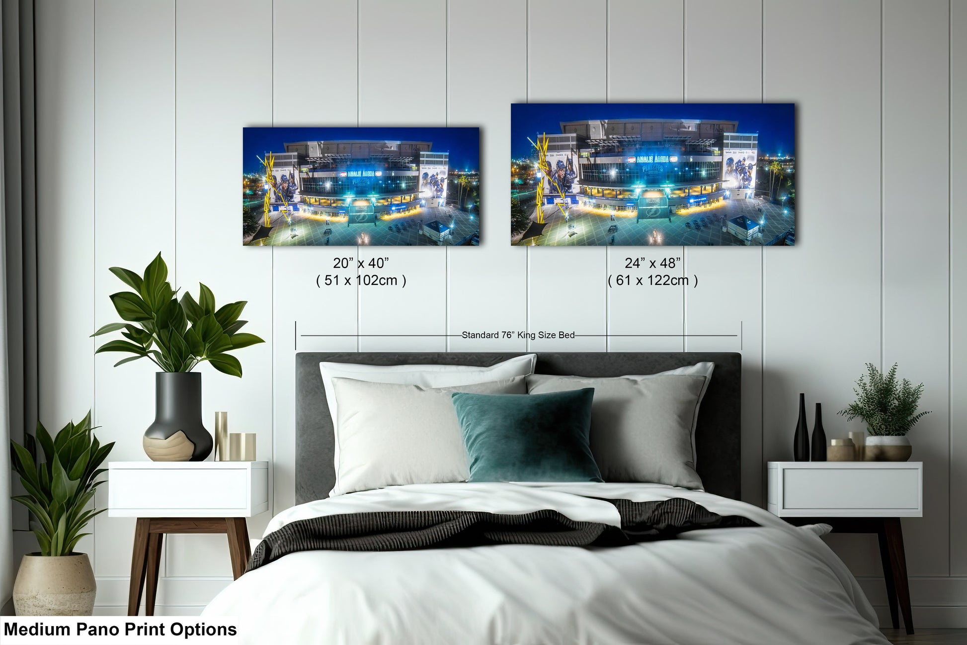 a bed room with a neatly made bed and two pictures on the wall