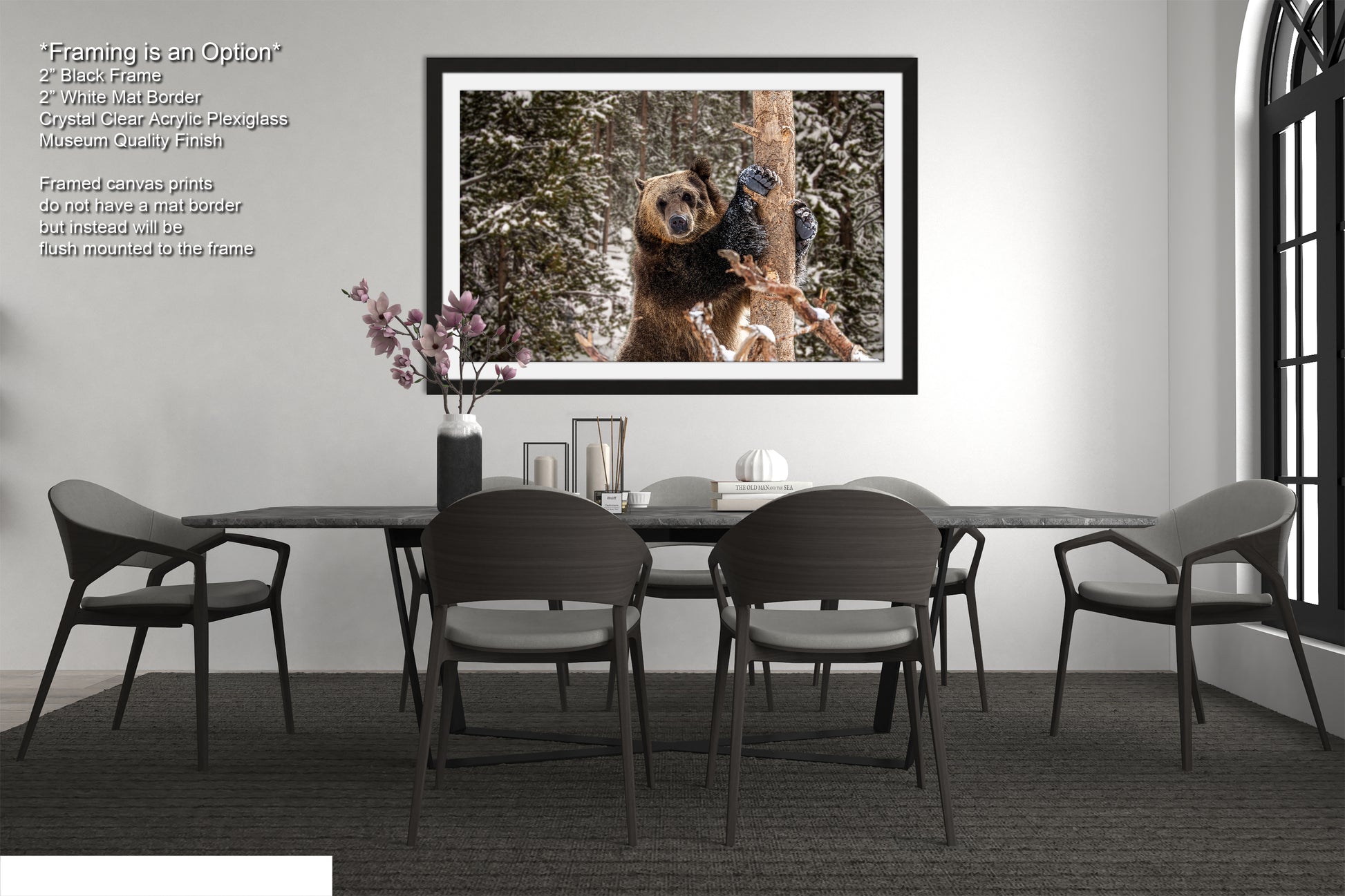 a dining room table with chairs and a picture hanging on the wall