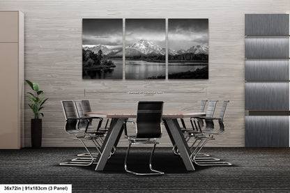 a black and white photo of a table and chairs