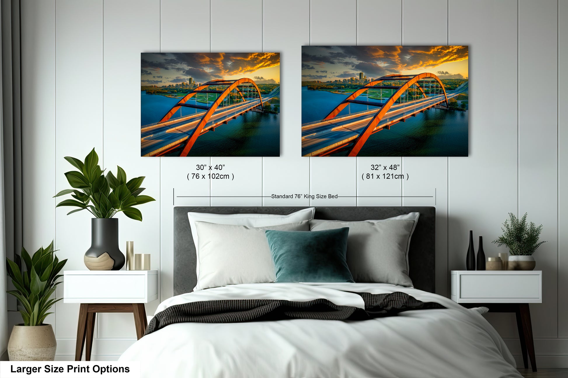 a bed with two pictures of a bridge hanging on the wall
