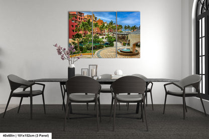 a dining room table with chairs and a painting on the wall