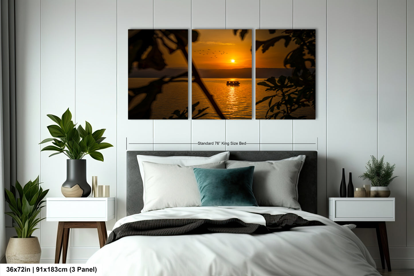 a bedroom with a bed and a picture of a sunset