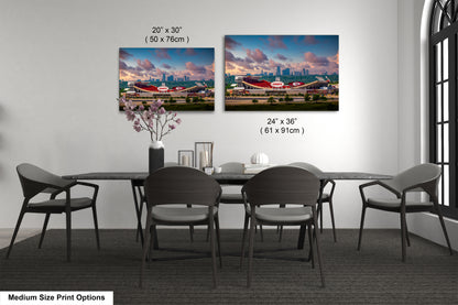 a dining room table with four chairs and a vase with flowers