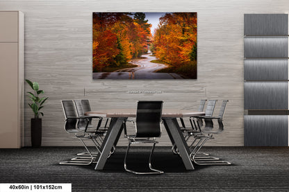 a dining room table with chairs and a painting on the wall