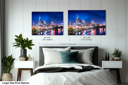 a bedroom with a bed and two pictures on the wall
