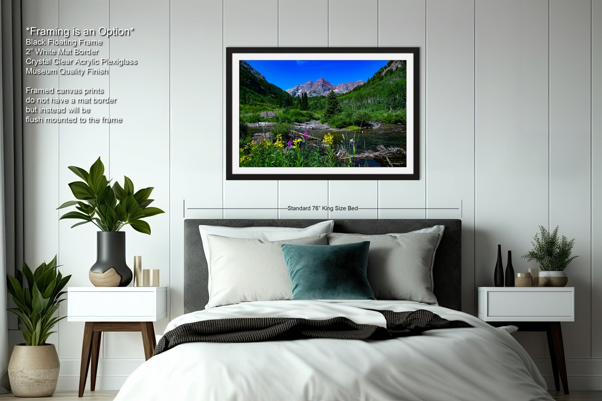 a bedroom with a bed and a picture hanging on the wall