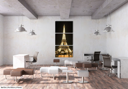 a room with chairs, a desk and a picture of the eiffel tower