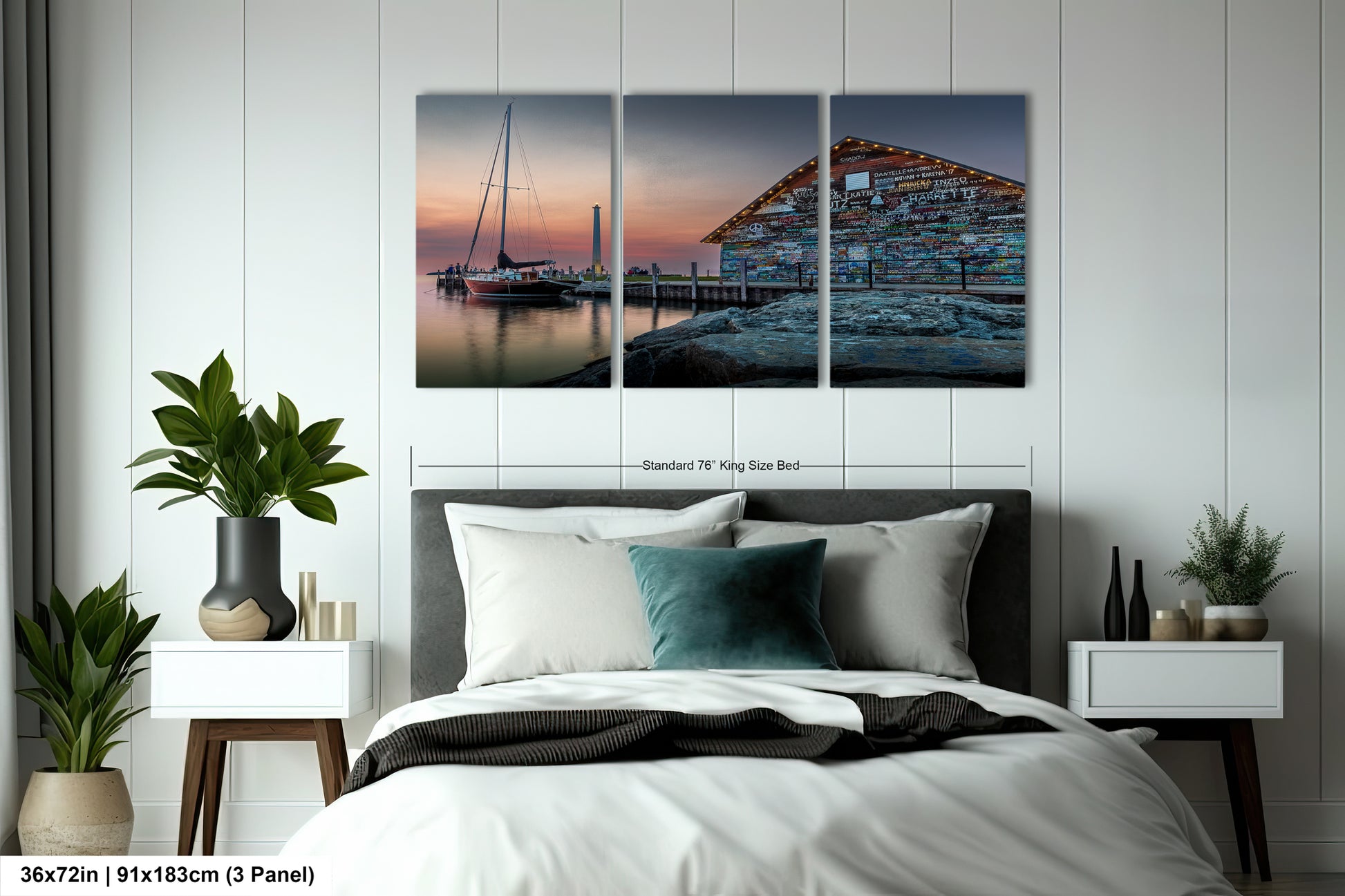 a modern office space with a large wooden table surrounded by black chairs. Above the table, there is a framed photograph of a building with a sailboat docked in front of it, creating a serene and coastal atmosphere.