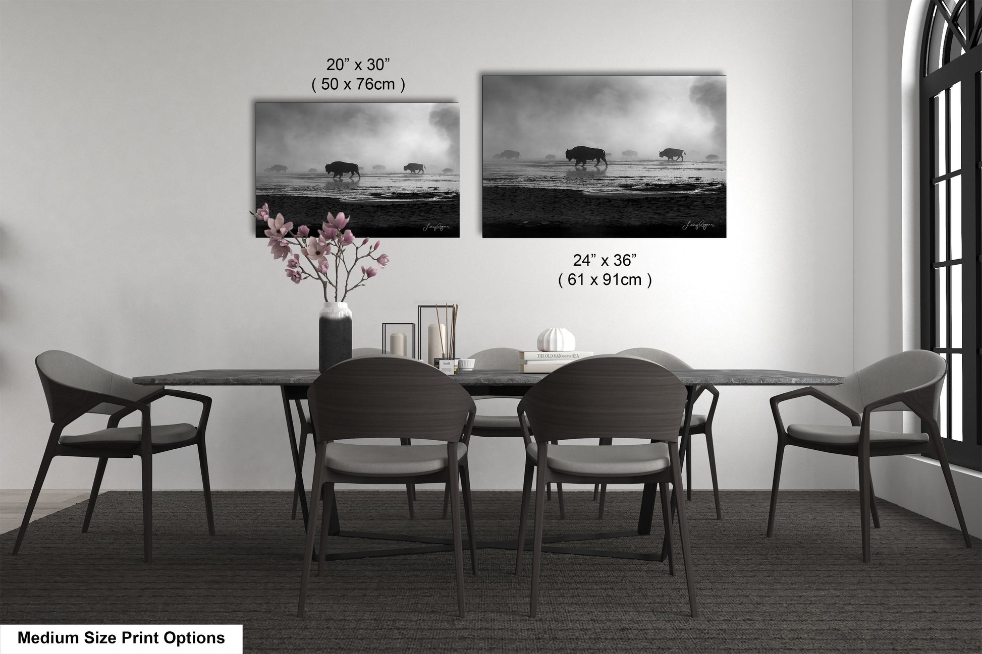 a dining table with four chairs and a vase of flowers