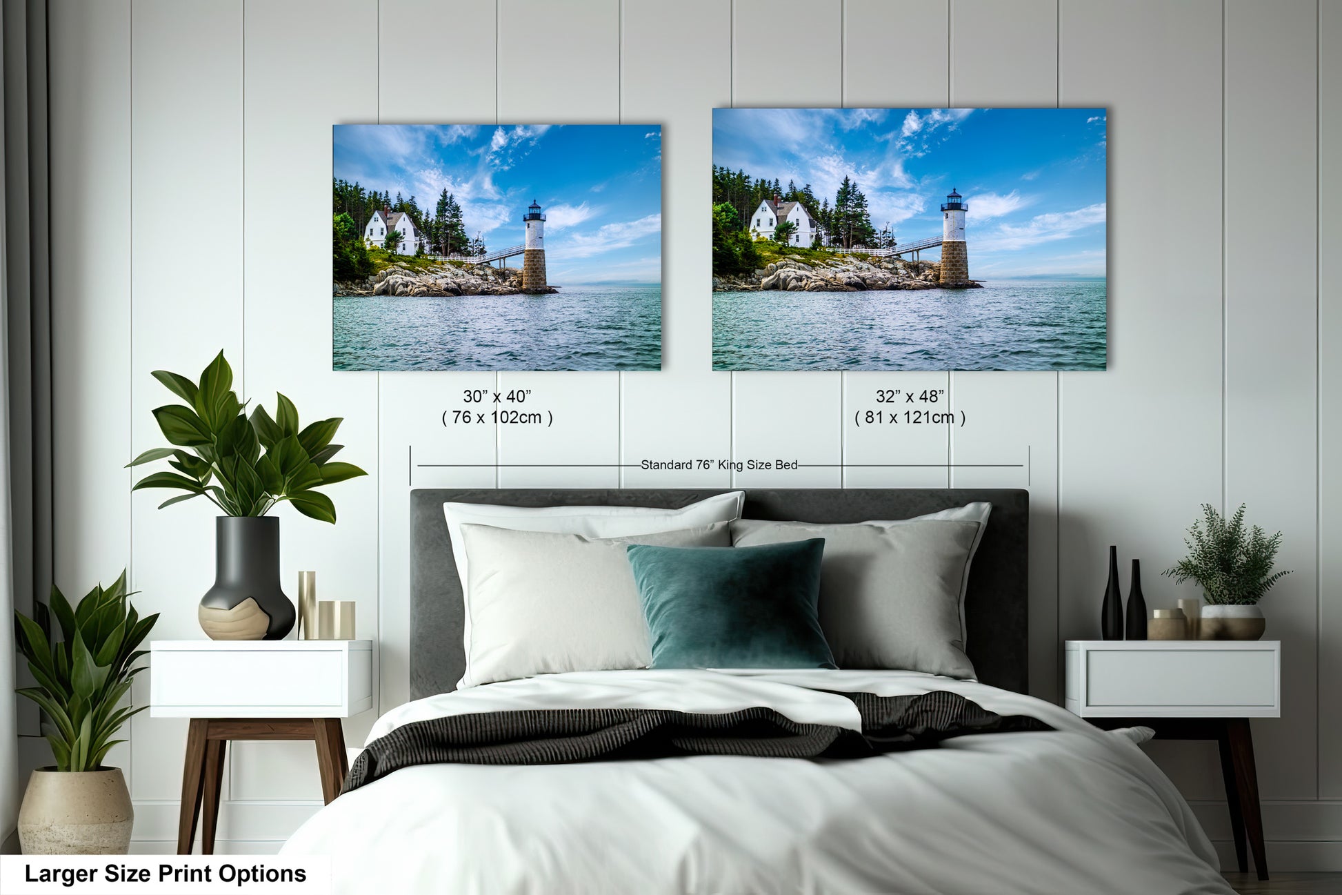 a bed with two pictures on the wall above it