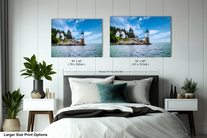 a bed with two pictures on the wall above it