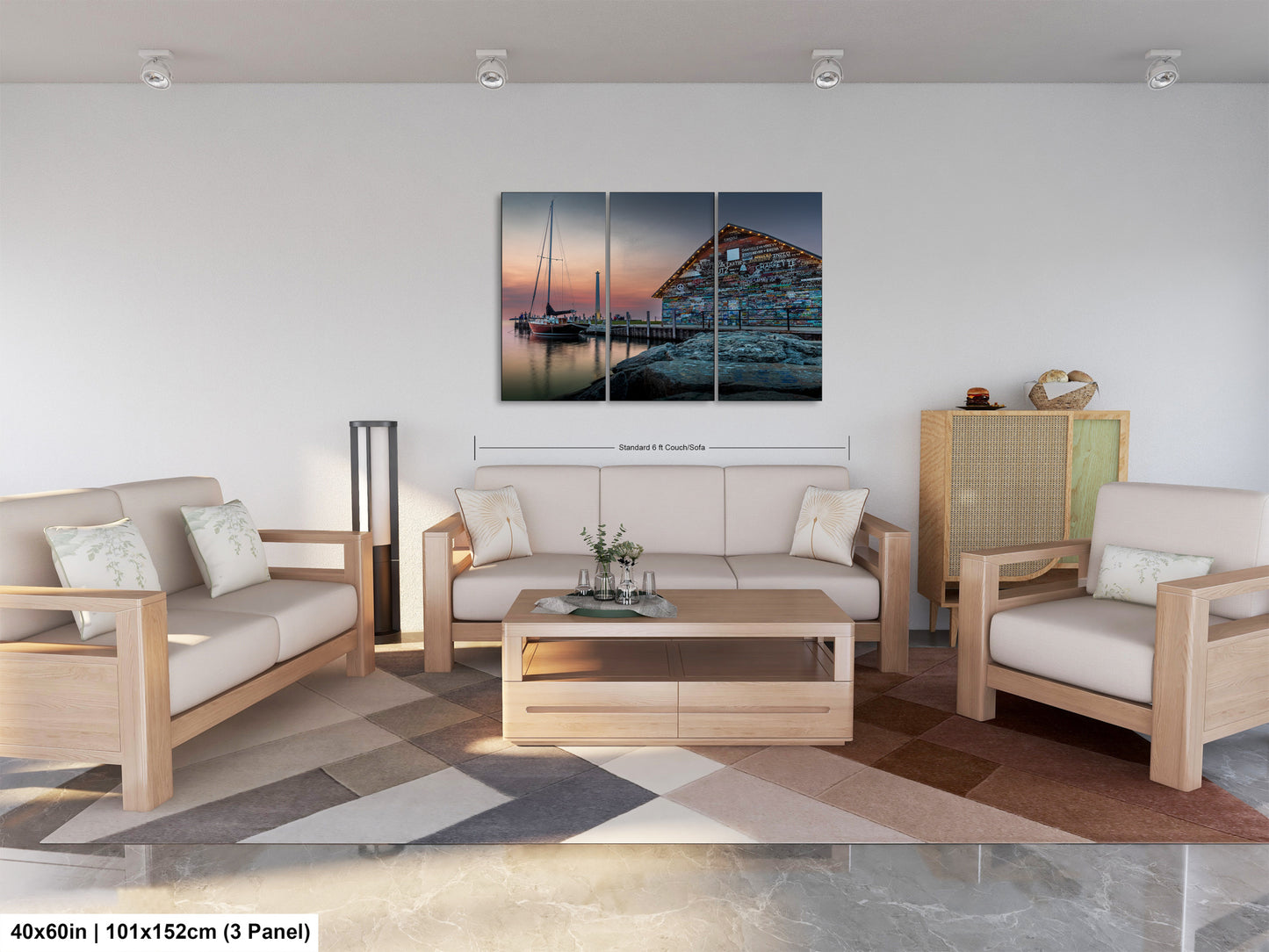 The image is a modern living room with a large, colorful painting of a boat on the wall. The room is furnished with a sofa, two chairs, and a coffee table. The painting is a collage of three panels, depicting a seascape with a building and boats in the background. The room has a minimalist and clean design, with white walls and a neutral color palette.