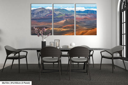 a modern dining room with a large panoramic landscape painting hanging on the wall above a black dining table surrounded by six chairs.