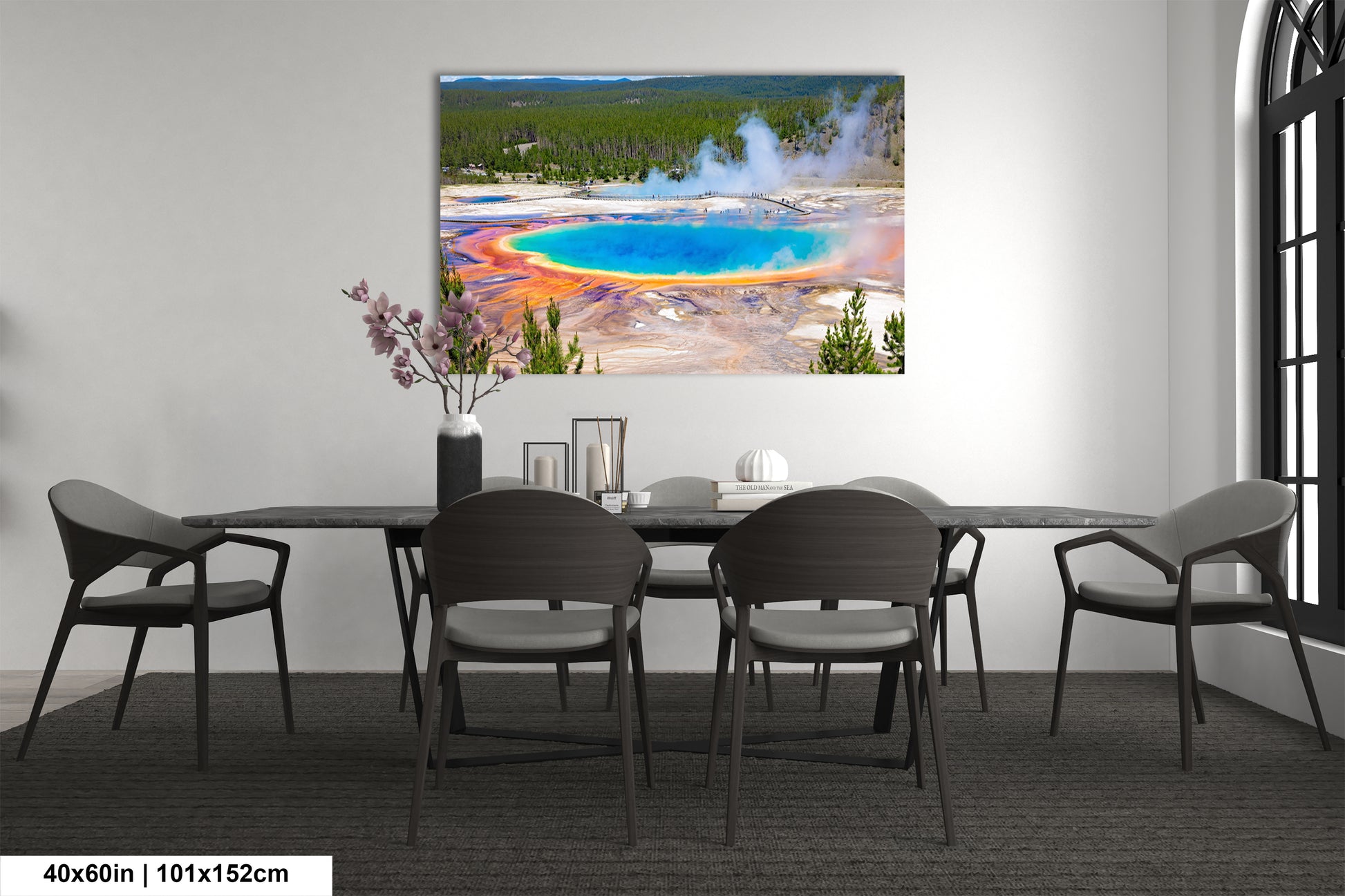 a dining room table with chairs and a painting on the wall