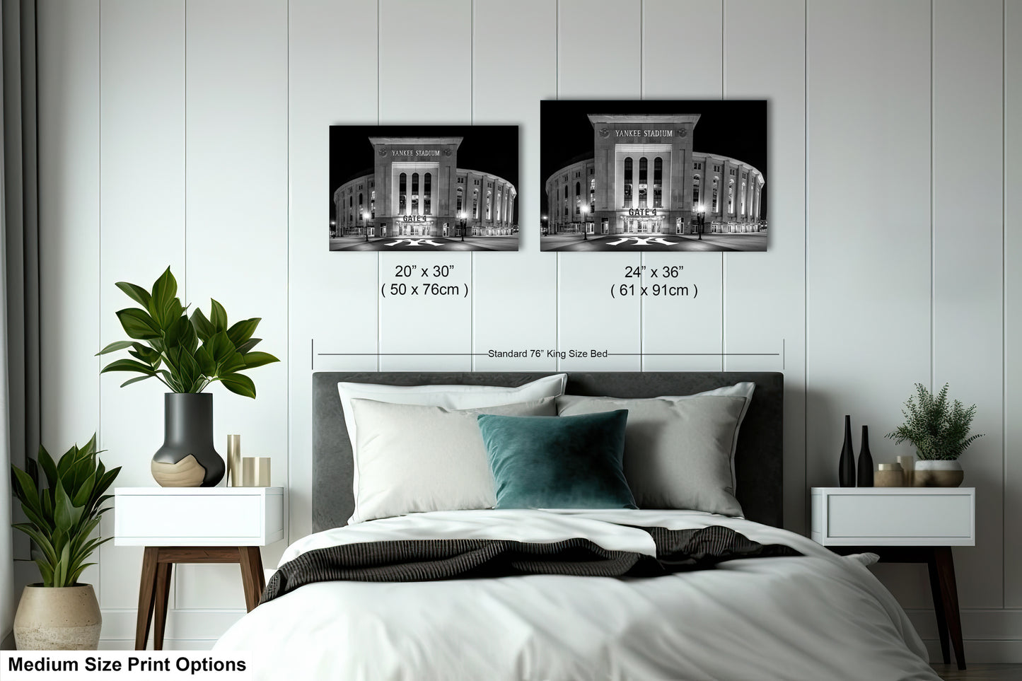 a bedroom with a bed, nightstands, and potted plants. There are two framed black and white photographs of a building, likely a stadium, hanging on the wall above the bed. The photographs are of different sizes, with one being larger than the other. The bed has a white comforter and a blue throw pillow.