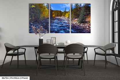 a dining room table with chairs and a painting on the wall