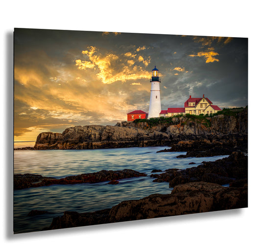 a picture of a lighthouse on a rocky shore