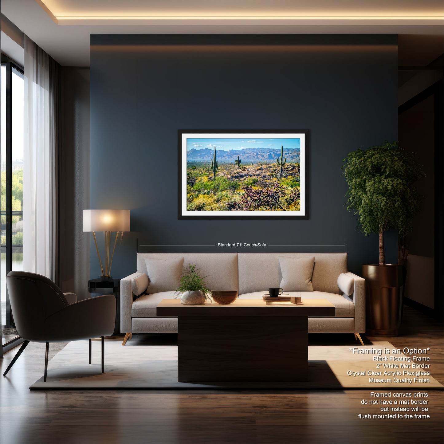a modern living room with a large framed landscape painting hanging on the wall, a white sofa, a wooden coffee table, and a large window overlooking a desert landscape.