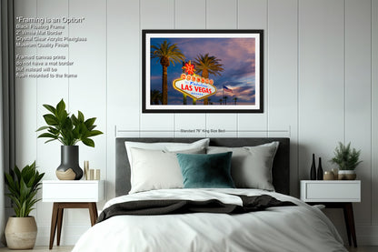 a las vegas sign with palm trees in the background