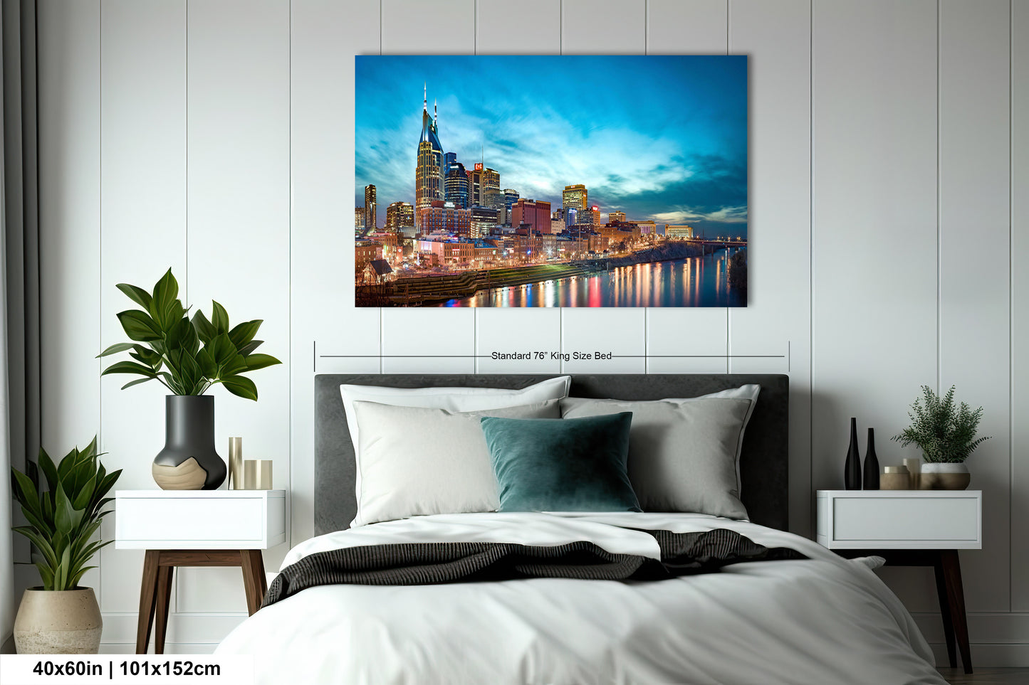 a bedroom with a bed and a painting on the wall