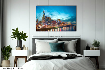 a bedroom with a bed and a painting on the wall