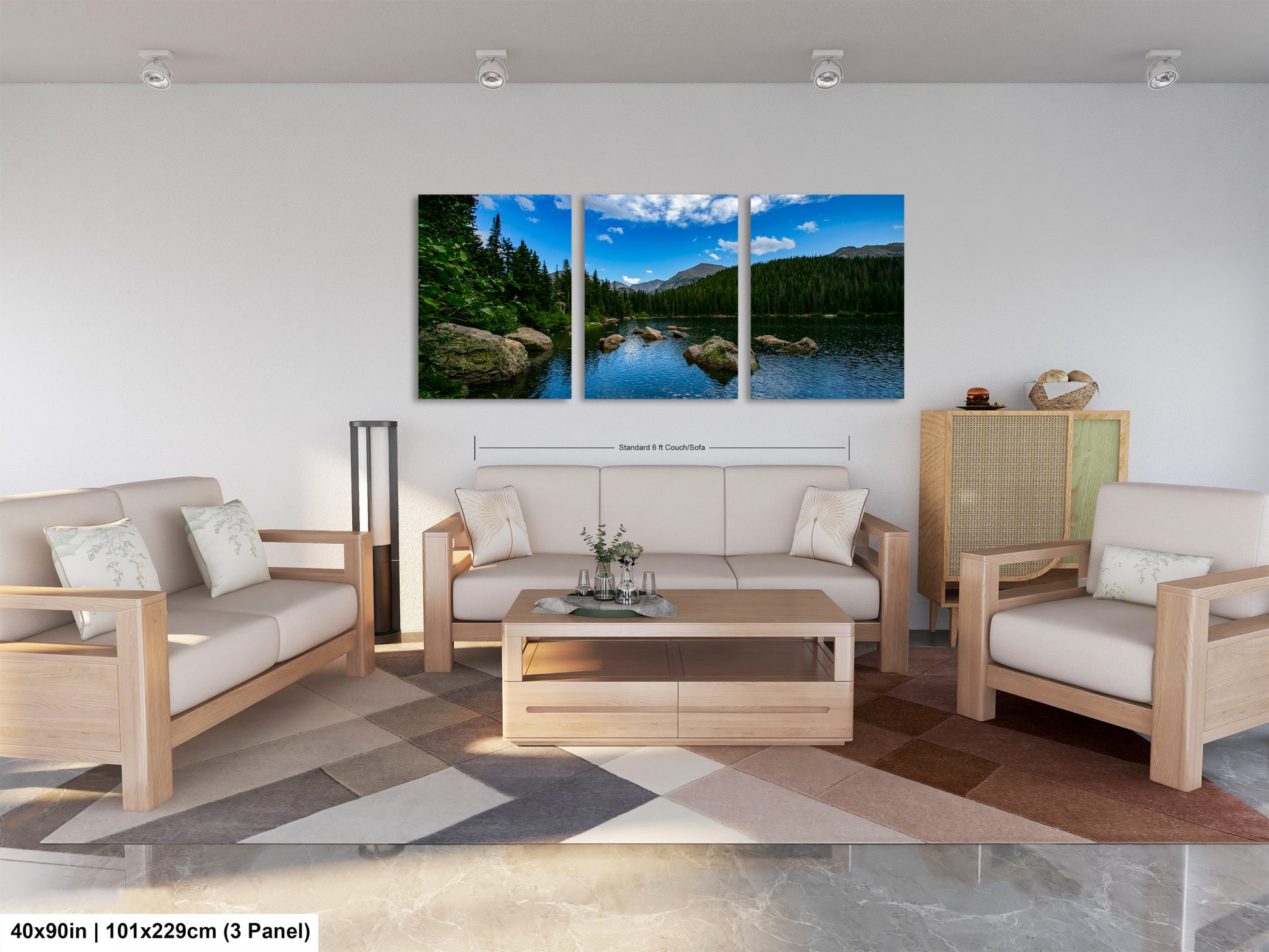 The image is a modern living room with a large, three-panel landscape painting hanging on the wall. The painting depicts a serene mountain lake surrounded by trees and mountains, creating a peaceful and natural atmosphere. The room is furnished with a sofa, two armchairs, and a coffee table, providing a comfortable and inviting space for relaxation and socializing.
