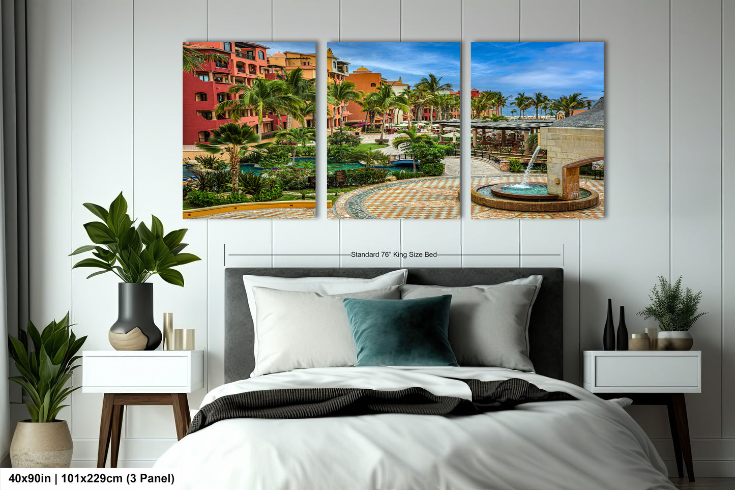 a bed room with a neatly made bed and paintings on the wall