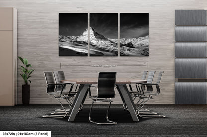a black and white photo of a dining room table