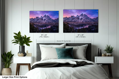 a bedroom with a bed and two pictures on the wall