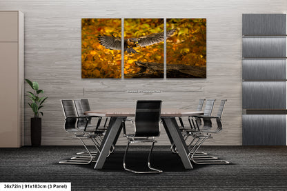 a table and chairs in a room with a painting on the wall