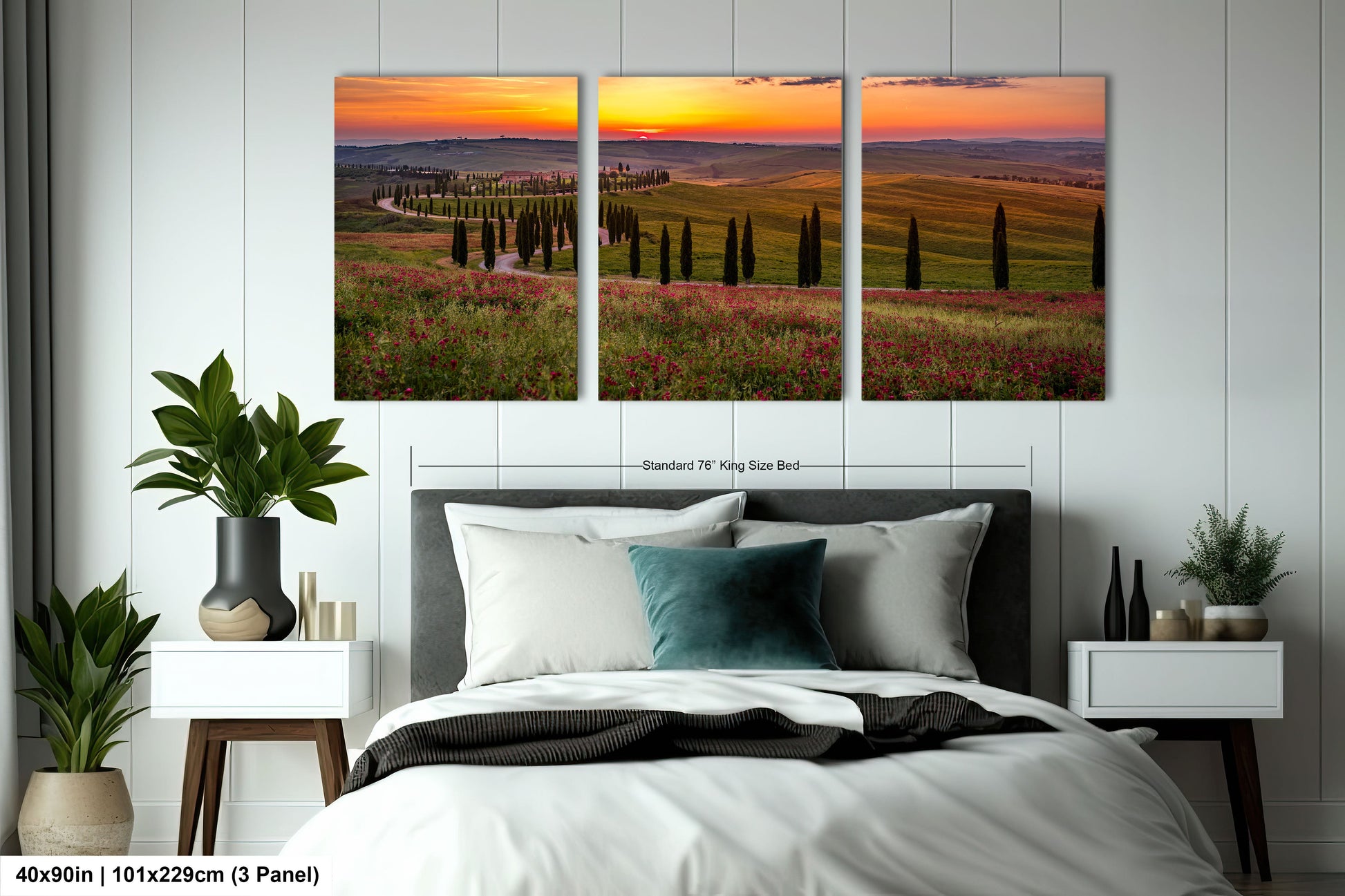 a bed room with a neatly made bed and two paintings on the wall