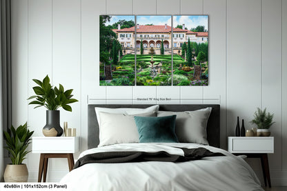a bedroom with a large bed and a painting on the wall