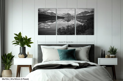 a black and white photo of a bedroom