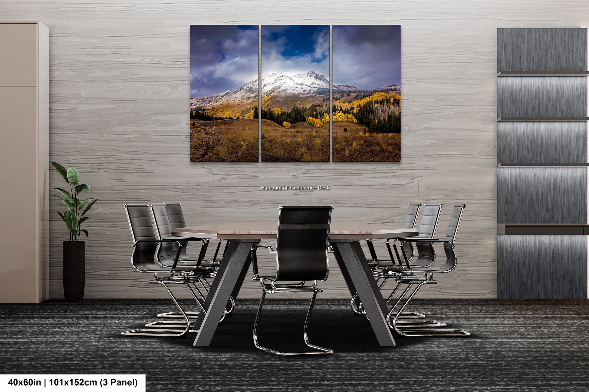 a dining room table with chairs and a mountain in the background