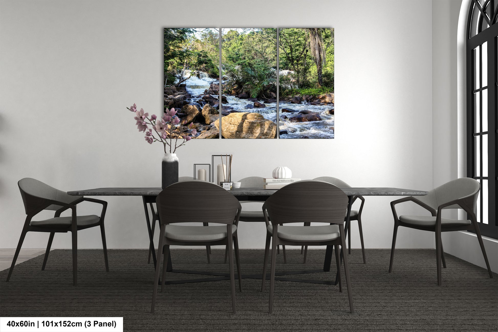 a dining room table with chairs and a painting on the wall