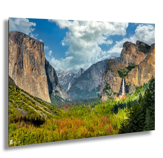 a scenic view of mountains and a waterfall