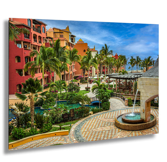 a picture of a resort with a fountain and palm trees