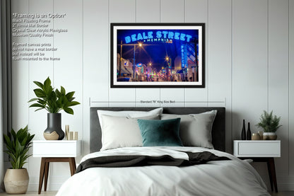 a bedroom with a bed and a picture hanging on the wall