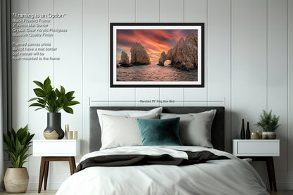 a bedroom with a bed and a picture on the wall