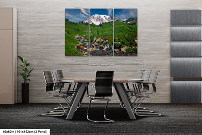 a dining room table with chairs and a painting on the wall