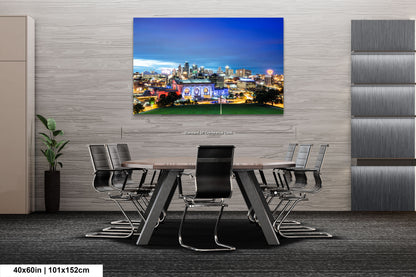 a picture of a city at night taken from a dining room table