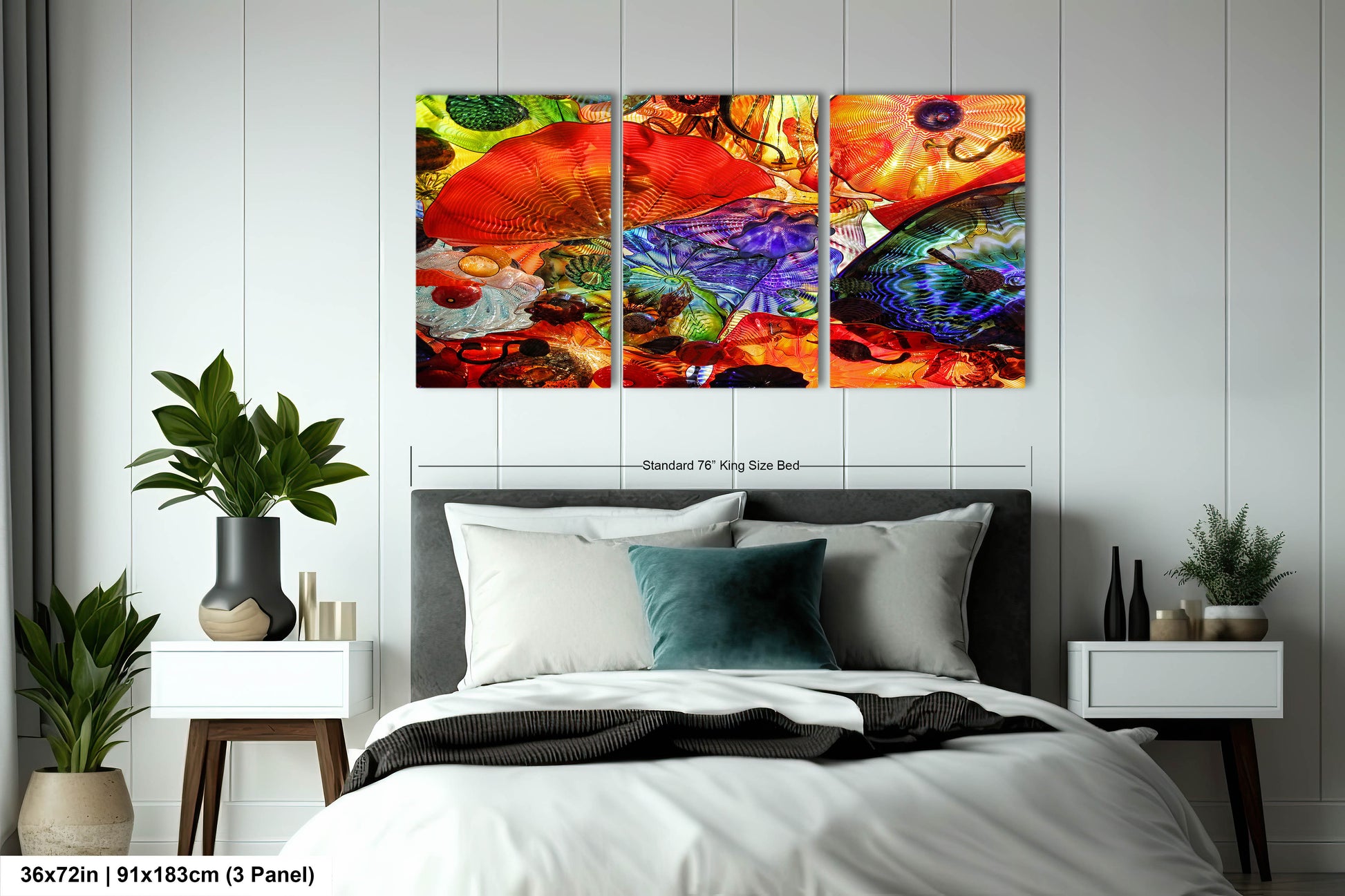 a bed room with a neatly made bed and paintings on the wall