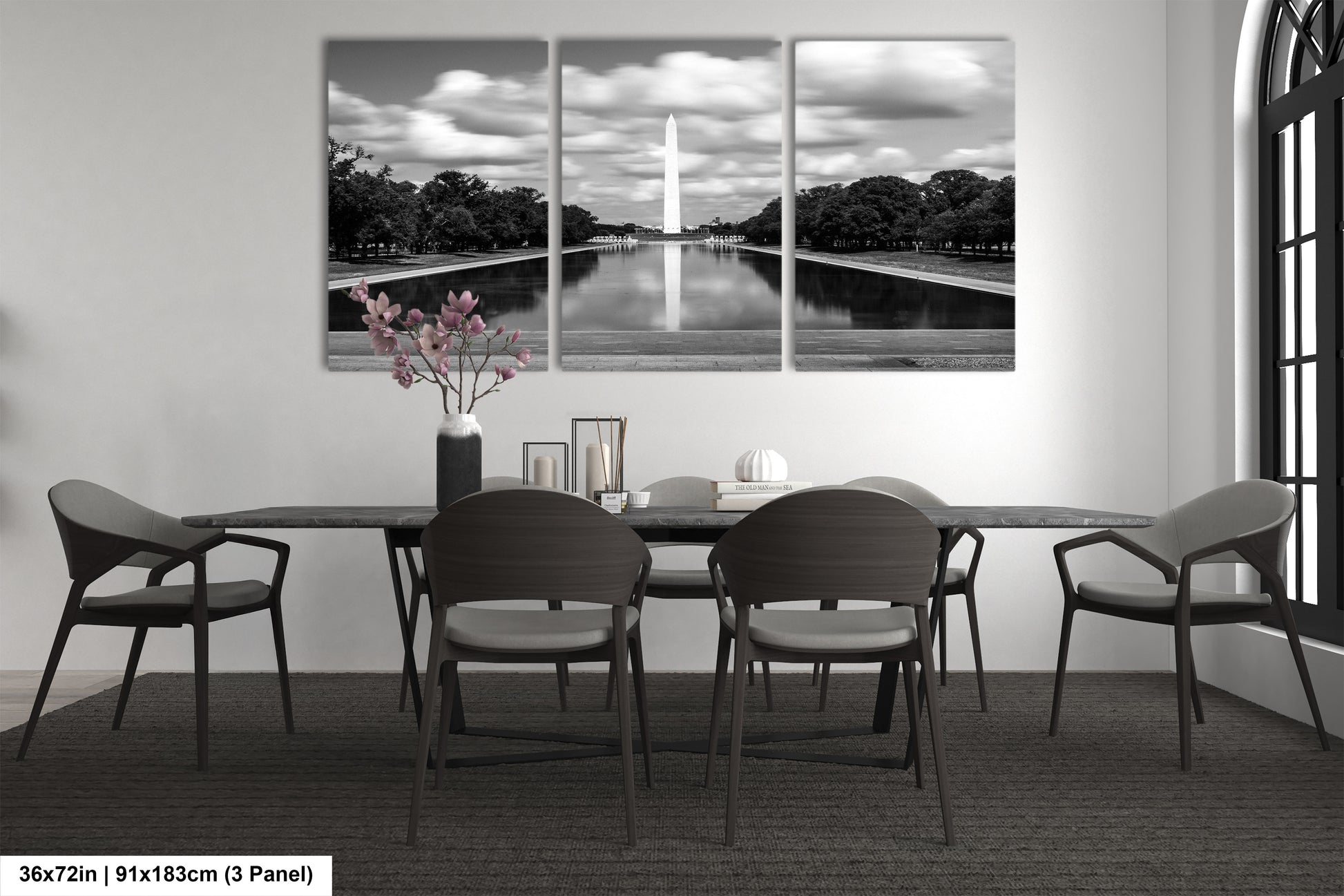 a black and white photo of a dining room table