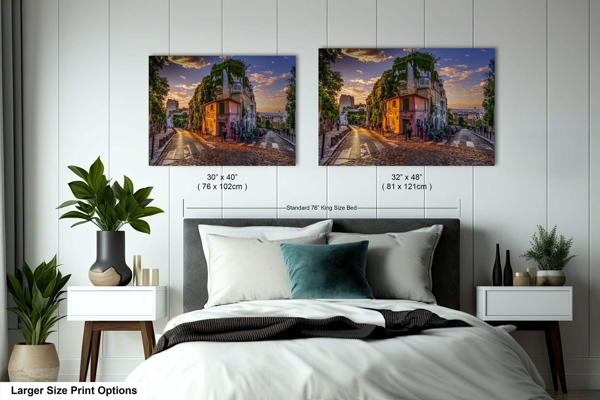 a bed with two pictures on the wall above it