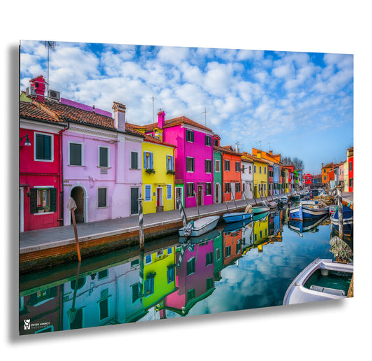 a canal filled with lots of colorful buildings