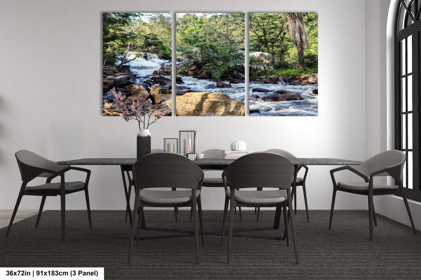 a dining room table with chairs and a painting on the wall